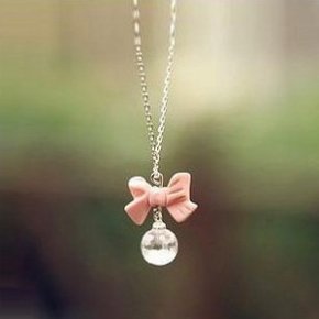 pink bowknot and pearl necklace